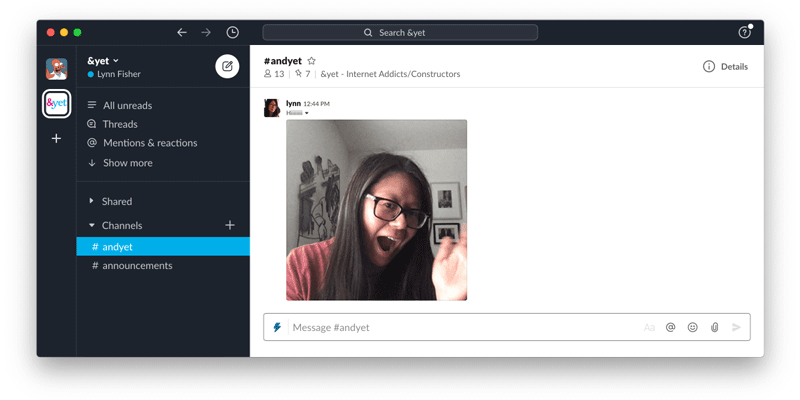 Slack chat with an animated gif of a person waving